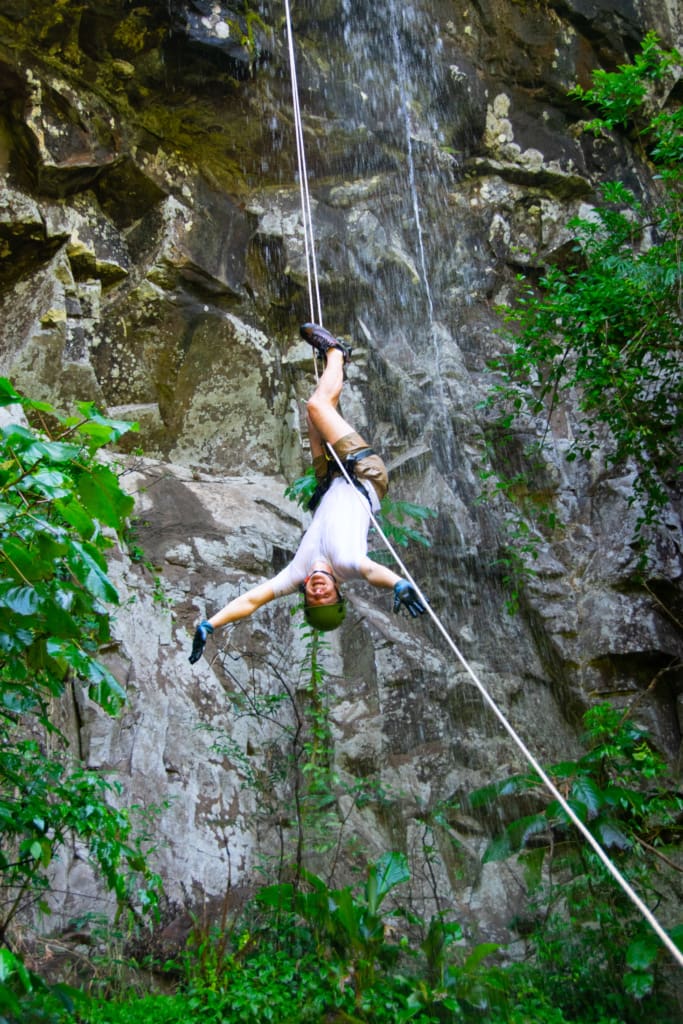 Me hanging upside down on the rappelling rope before our Iguazu Falls boat ride on the Brazil side