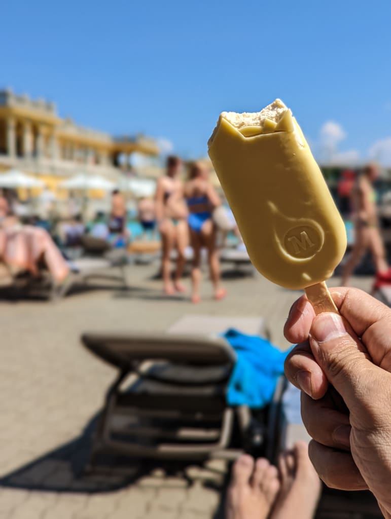 Eating an ice cream bar at the pool