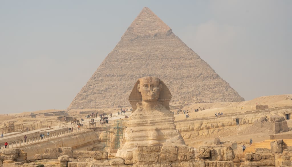 The sphinx in font of a pyrmid