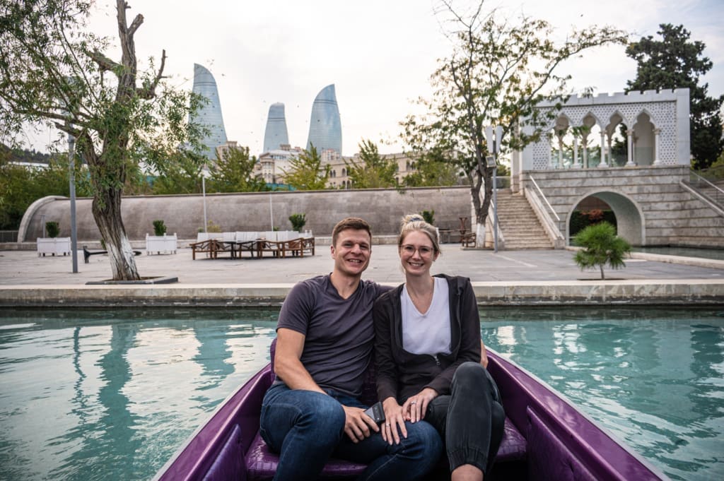 Tony and Katarina in Mini-Venice with the Flame Towers in the background in Baku during our short itinerary visit